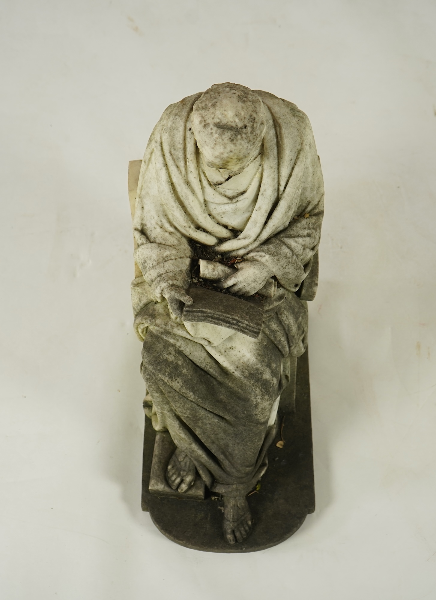 A marble sculpture of a gentleman dressed as a Greek philosopher, seated in a klismos chair, first half 19th century